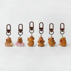 Set of 6 cute resin capybara bag charms featuring different poses including a hot tub capybara, lotus flower capybara, and capybara with an orange on its head.