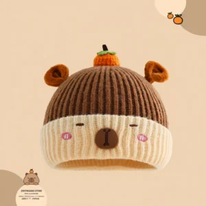 Two-tone knitted capybara hat with a cute orange persimmon decoration on top.