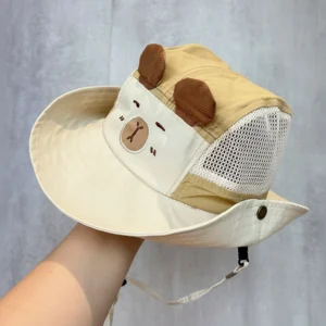 A khaki children's safari sun hats featuring mesh sides, a capybara face patch, and snap buttons on the brim.