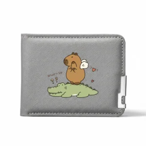 Grey textured bi-fold wallet featuring a cartoon capybara riding a crocodile, displayed against a white background with a silver metal corner clip.