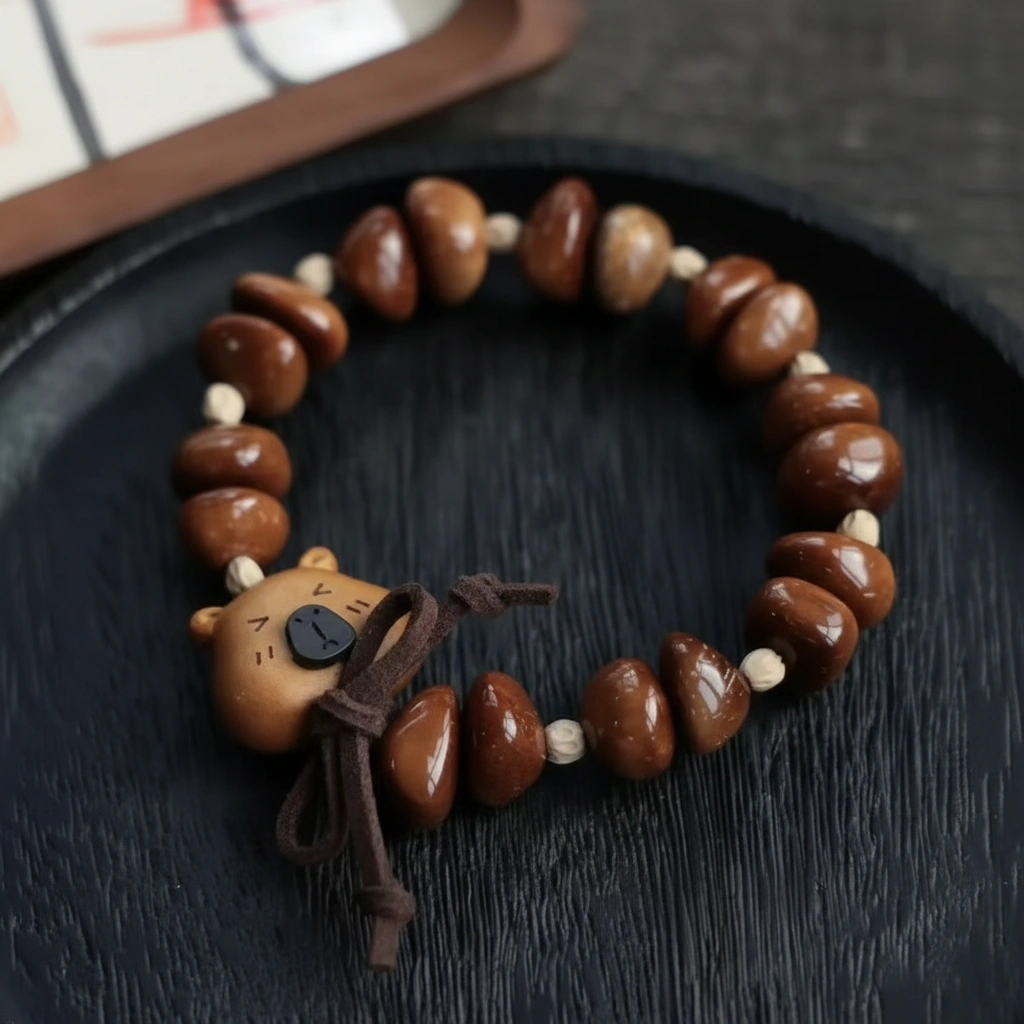 Hand-Carved Capybara Peach Wood Bracelet with Natural Kuka Nut Beads