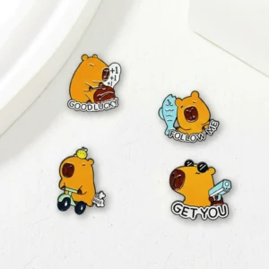Set of four funny enamel pins featuring a capybara hitting a wooden fish for luck, riding a scooter, holding a pistol with sunglasses, and holding a blue fish.