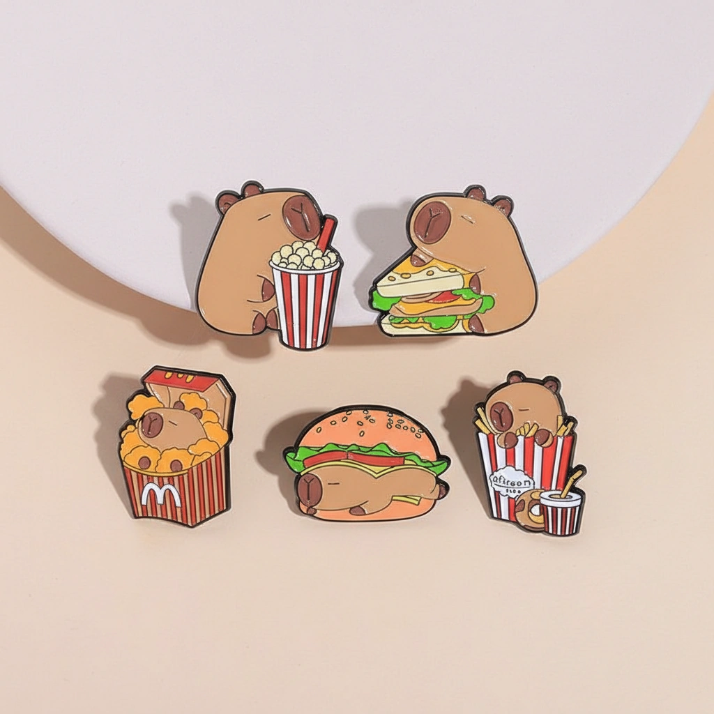 Set of five food-themed enamel pins featuring a capybara taco, pink donut, coffee cup, cafe saucer, and birthday cake with funny text.