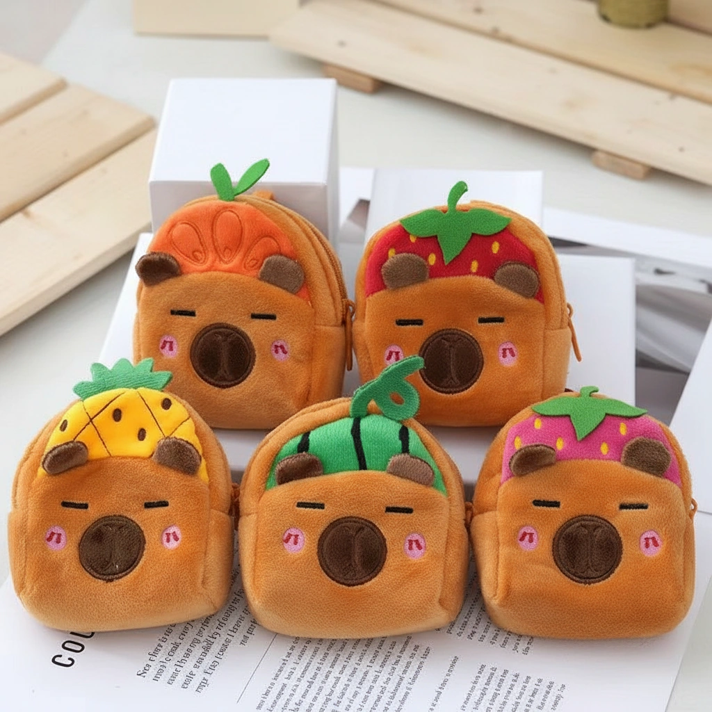 Set of 5 mini plush backpack coin purses featuring capybaras wearing colorful fruit hats including pineapple, watermelon, and strawberry.